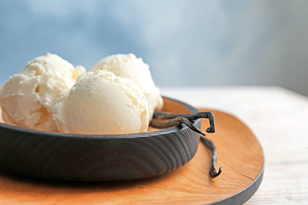 Plate with tasty vanilla ice cream on table - Fotoğraf, Görsel