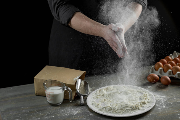 close-up photo of male hands in white flour on kitchen background - Foto, Imagen