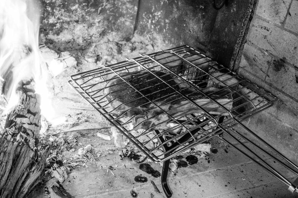 View of metal grate inside of the fireplace, Greece - Φωτογραφία, εικόνα