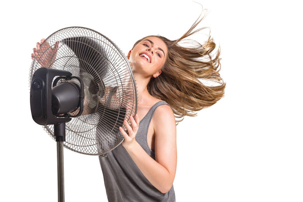 Young woman with cooler fan - 写真・画像