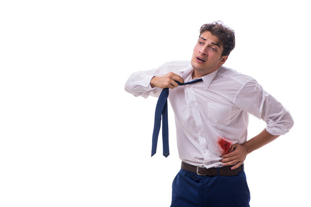 Wounded businessman with blood stains isolated on white backgrou - 写真・画像
