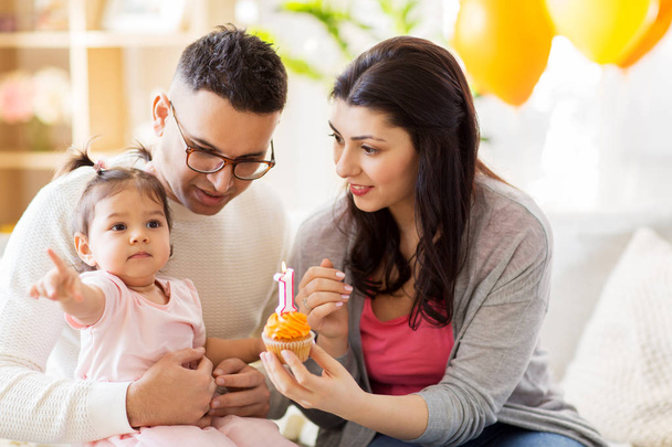 baby girl with parents at home birthday party - Photo, Image