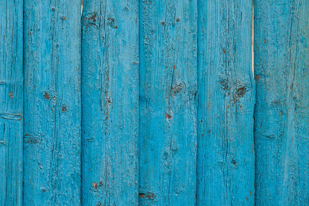 old wooden planks with a blue background - Foto, afbeelding