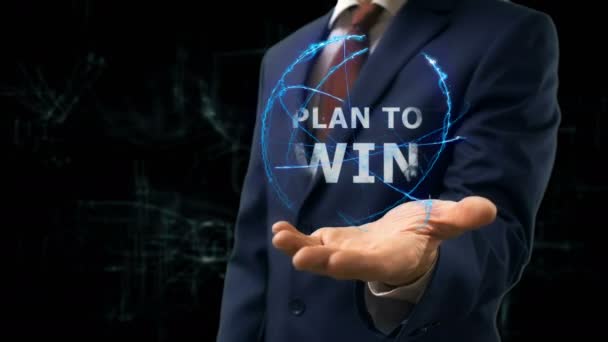 Geschäftsmann zeigt Konzept Hologramm Plan auf seiner Hand zu gewinnen - Filmmaterial, Video