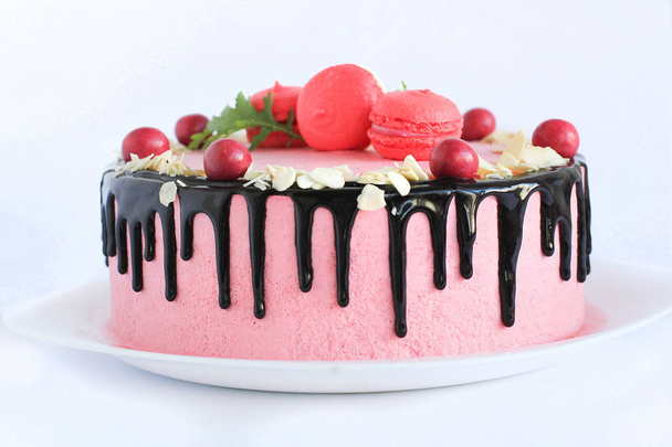 Tasty pink homemade cake decorated by red candies - Fotografie, Obrázek
