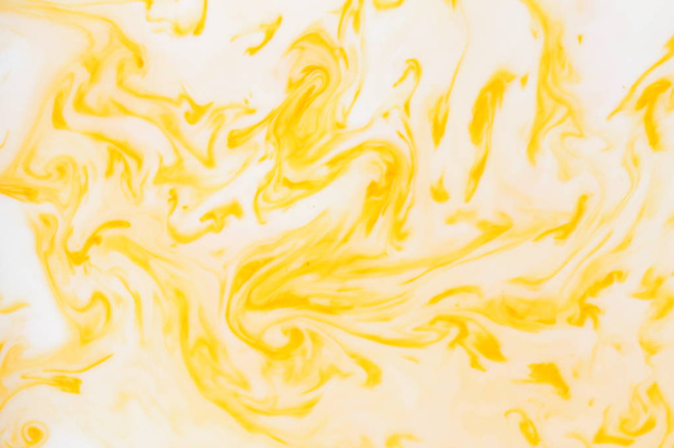 Yellow white abstract background, yellow pattern of paints on liquid, blank for designer, paint divorces in milk, bright texture on white background, minimalism, creative blank for wallpaper - 写真・画像