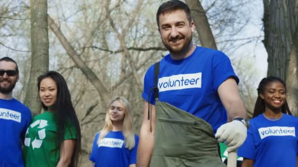 Cheerful multiethnic volunteers in forest - Footage, Video