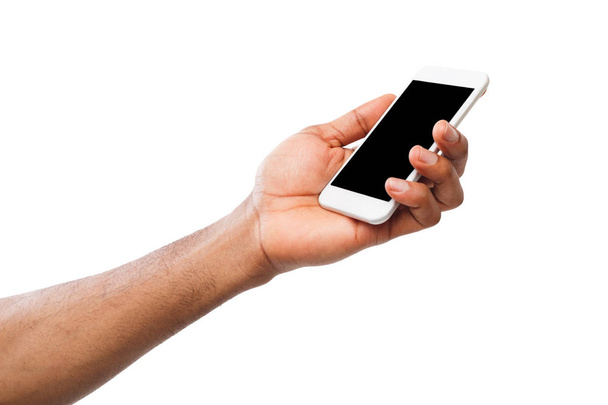 Mano que sostiene el teléfono inteligente móvil con pantalla en blanco
 - Foto, Imagen