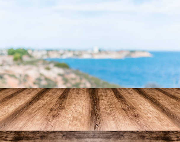 Wooden empty table board in front of blurred background. Can be used for display or montage any product. Mock up for display your product. - Photo, Image