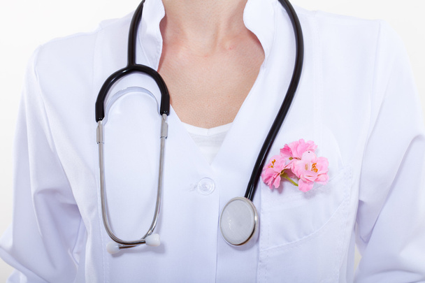 Beautiful woman doctor with a flower. - Foto, immagini