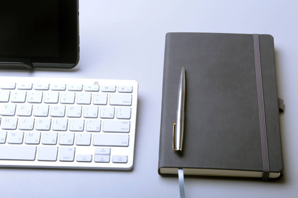 Corporate business desktop with laptop, digital tablet, accessories and work equipment. selective focus. - 写真・画像