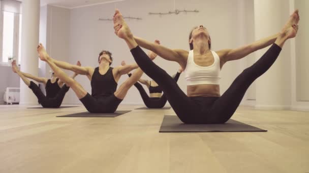 Yoga class. Reclining angle pose - Metraje, vídeo