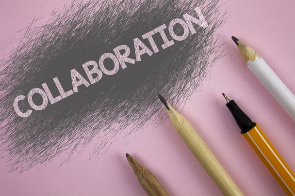 Text sign showing Collaboration. Conceptual photo Global industries partnership with teamwork to help others win written on Pink background Pen and pencils next to it. - Photo, Image