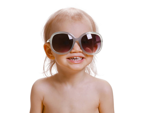 Portrait of cute caucasian baby 2-3 year old with big sunglasses on face. Isolated on white background - Fotó, kép