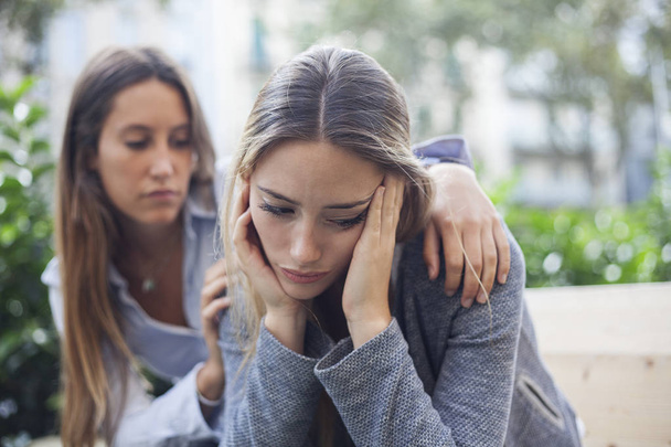 Woman comforting to a sad depressed friend who needs help. Depression concept - Foto, Bild
