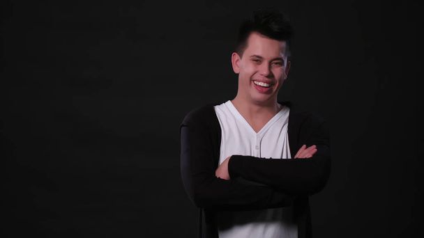 A Young Man Mimicing Against a Black Background - Photo, Image