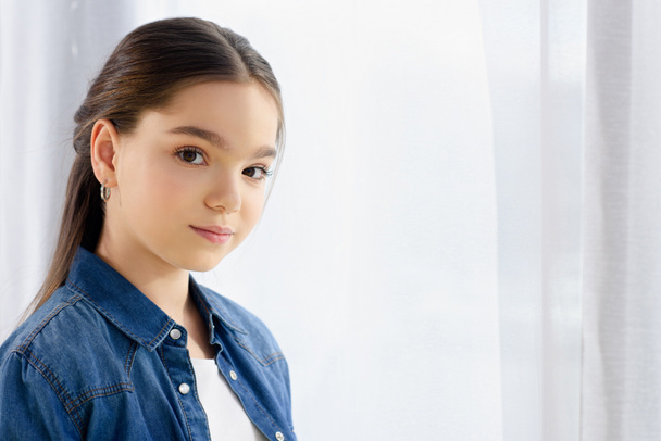 portrait of adorable preteen child looking at camera at home - Foto, Imagem