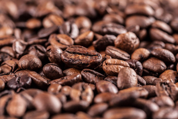 roasted coffee beans background, close-up view - 写真・画像
