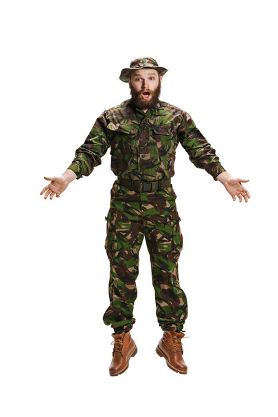 Young army soldier wearing camouflage uniform isolated on white - Φωτογραφία, εικόνα