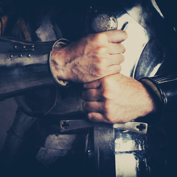 knight wearing armor and holding two-handed sword - Foto, Imagem
