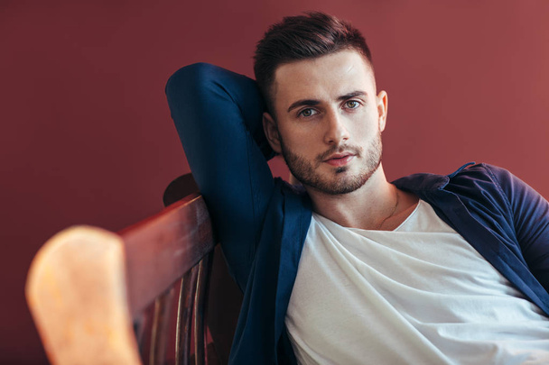 Portrait of handsome sexy man relaxing on sofa. - Photo, Image