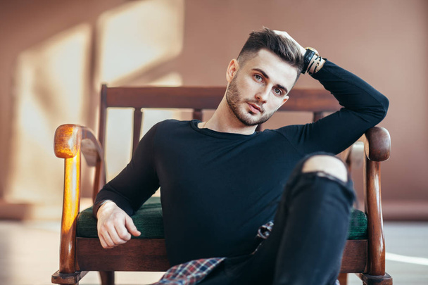 Portrait of handsome young man model posing in studio - Fotografie, Obrázek