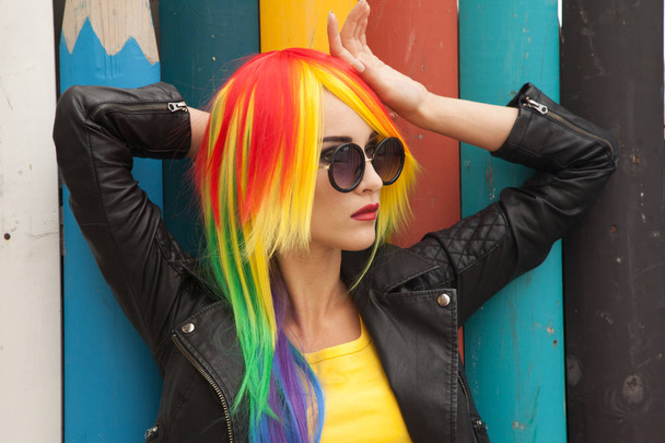 beautiful young woman wearing color wig and sunglasses - Valokuva, kuva