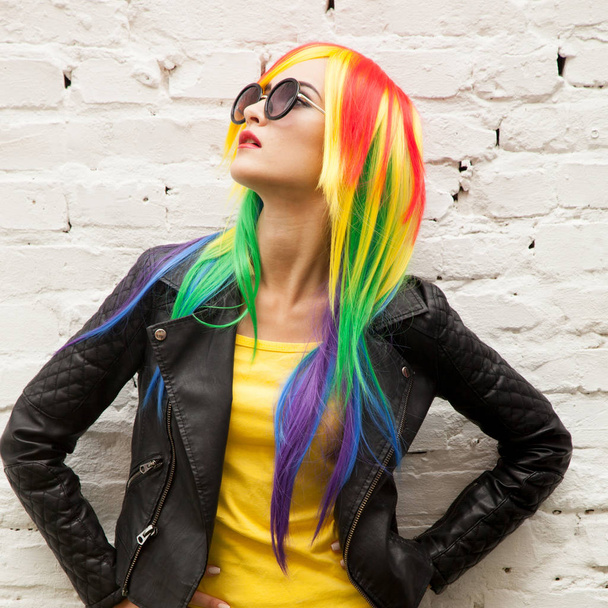 beautiful young woman wearing color wig and sunglasses - 写真・画像