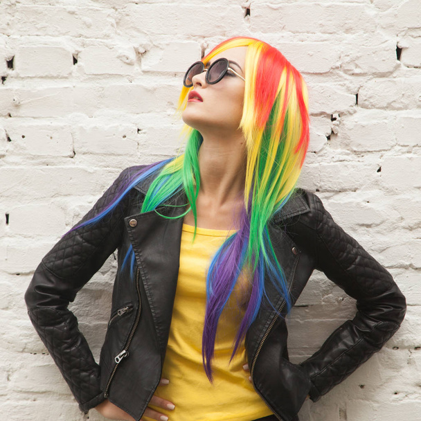 beautiful young woman wearing color wig and sunglasses - Photo, image