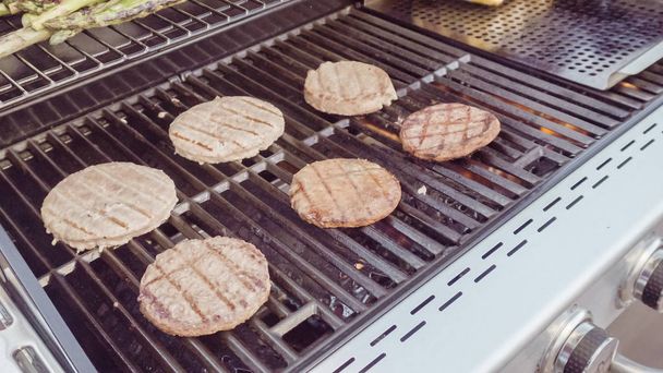 Burgers on grill view - 写真・画像