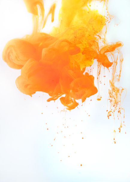 artistic background with flowing orange paint, isolated on white - Φωτογραφία, εικόνα