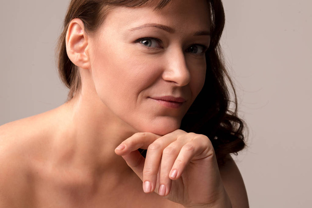 Portrait of beautiful sexy woman touching her hair - Fotografie, Obrázek