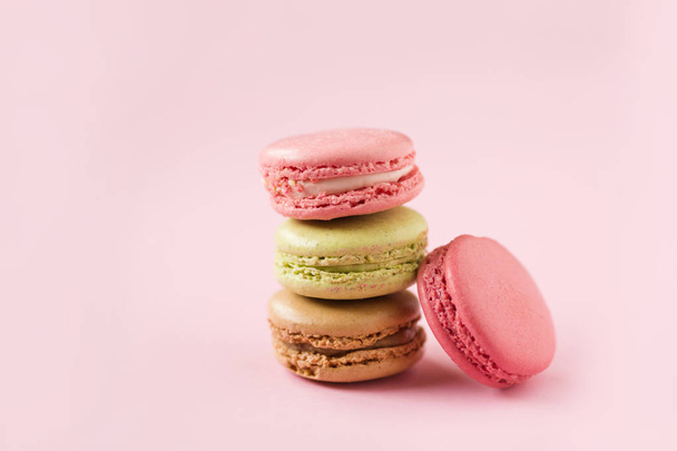 stack of color macaroons on pink background, top view - Photo, Image