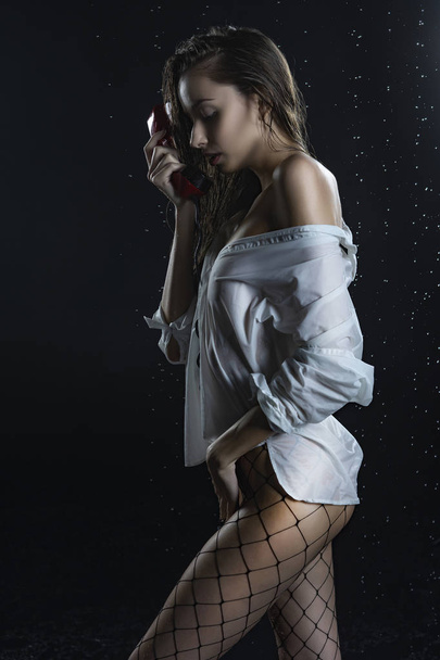 Beautiful wet naked shoulders slim girl wearing white wet shirt  - Foto, immagini