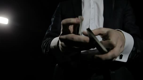 Magician shows tricks with cards - Felvétel, videó