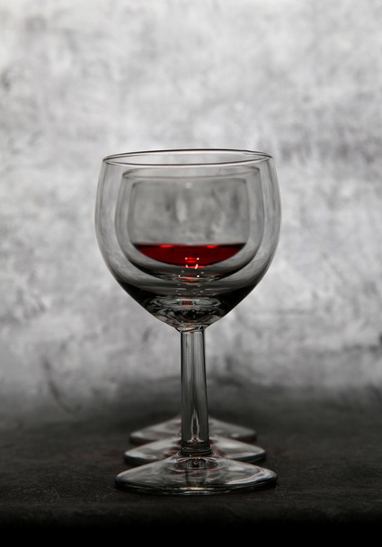 Three glasses on a gray background - Valokuva, kuva