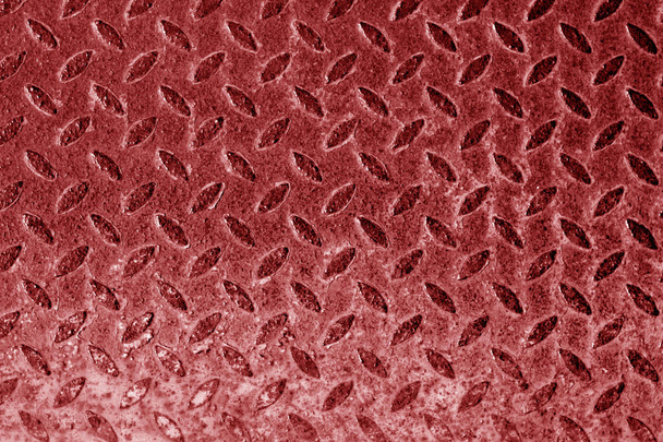 Diamond shaped metal floor pattern in red tone. - Фото, зображення