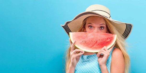 Happy young woman holding watermelon  - Valokuva, kuva