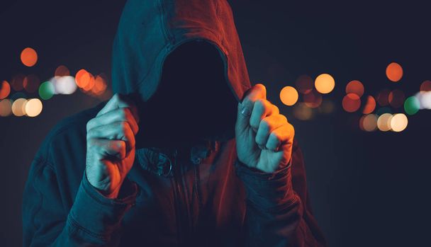 Faceless hooligan with hoodie in urban surrounding - Fotoğraf, Görsel