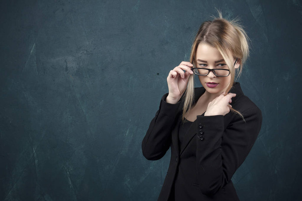 Young successful office working woman adjusting glasses. - Photo, Image