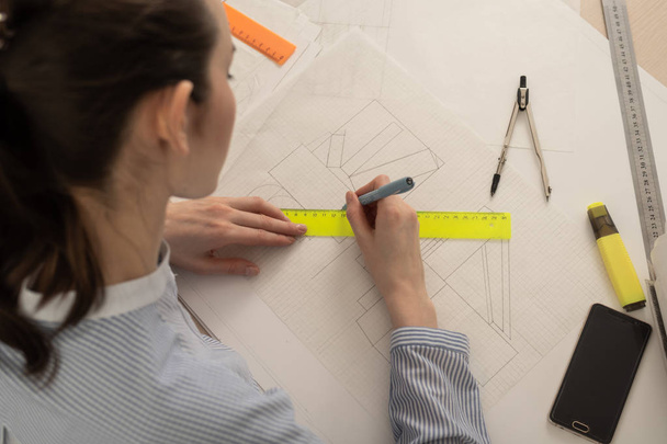 Student architect draws geometric shapes, design practice - Fotó, kép