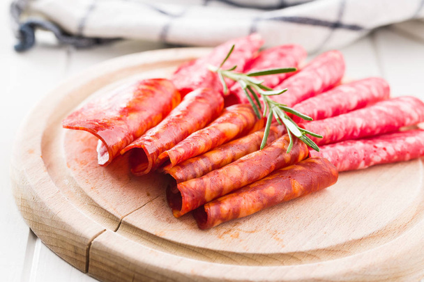 Slices of chorizo salami sausage. - 写真・画像