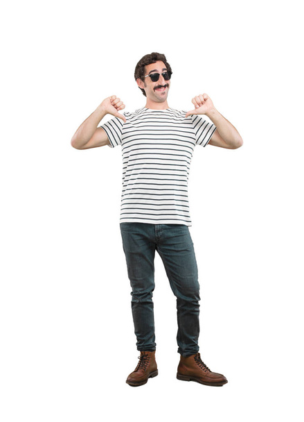 young crazy man in proud pose. Full body cutout person against white background. - Foto, immagini