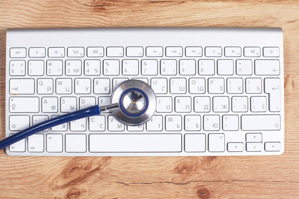 Close up of stethoscope on pc keyboard. Healthcare concept - Photo, Image