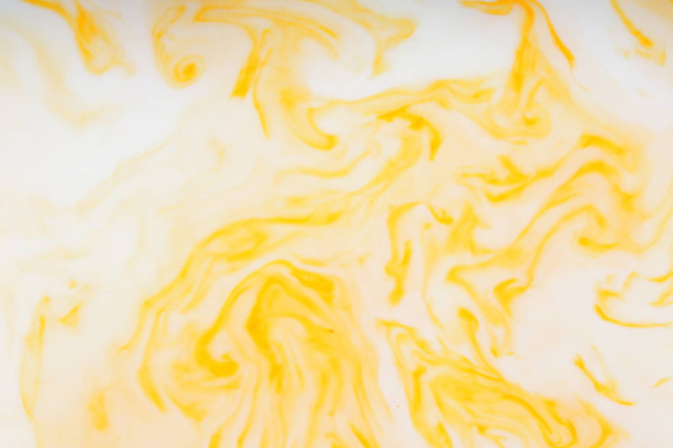 Yellow white abstract background, yellow pattern of paints on liquid, blank for designer, paint divorces in milk, bright texture on white background, minimalism, creative blank for wallpaper, art - Foto, afbeelding