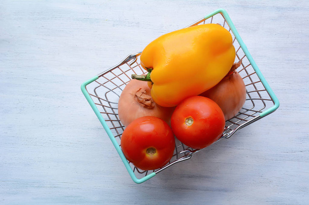 Shopping basket with vegetables - Фото, изображение