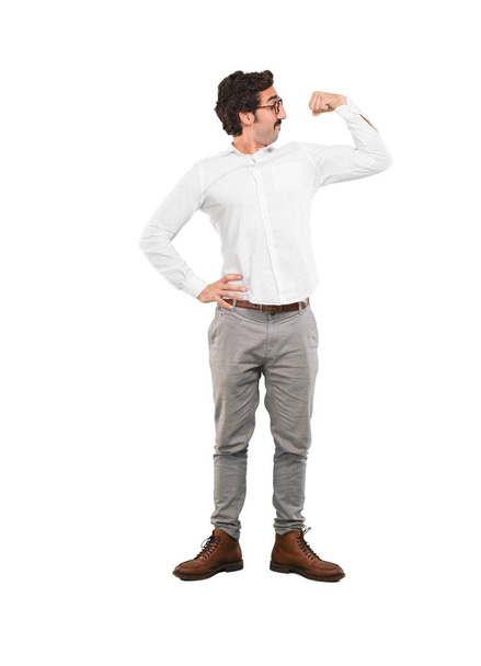 Young crazy man in strong pose. Full body cutout person against white background. - Valokuva, kuva