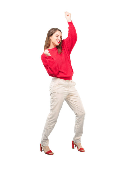 Young pretty woman dancing. Full body cutout person against white background. - Valokuva, kuva