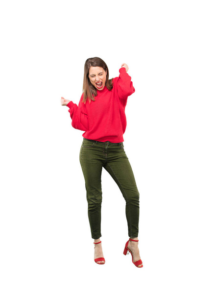 Young pretty woman dancing. Full body cutout person against white background. - Foto, afbeelding