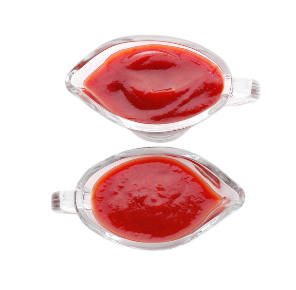 Gravy boats with delicious tomato sauce on white background - Photo, Image